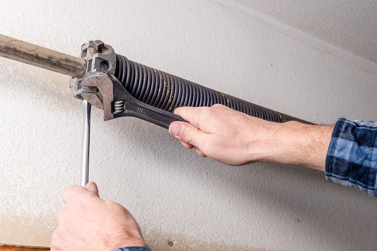 garage door spring being repaired