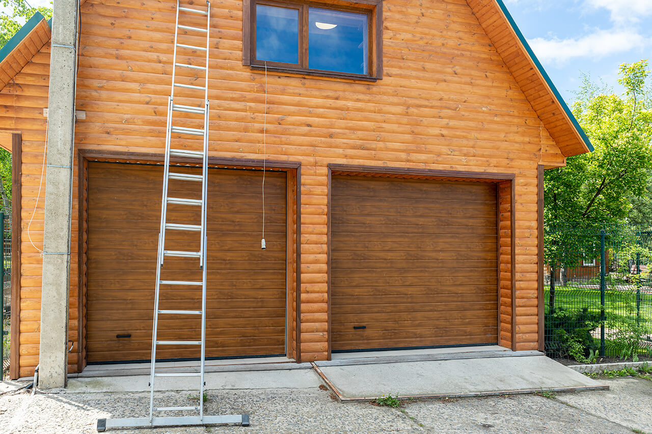 new home construction with log siding installed