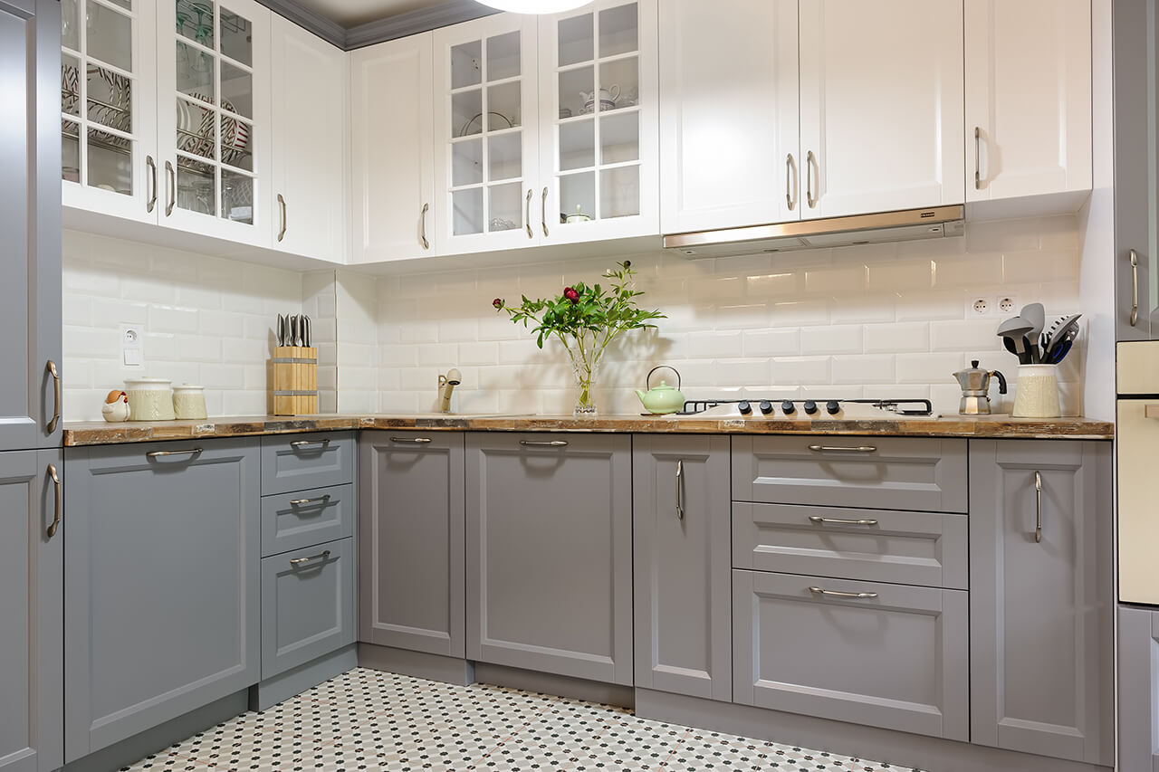 modern kitchen remodeled with new white and gray cabinet doors