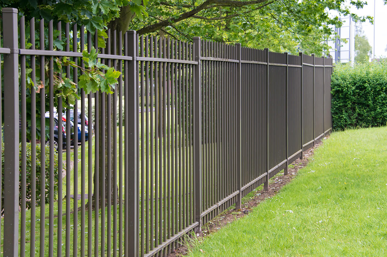 new wrought iron fence around yard of home