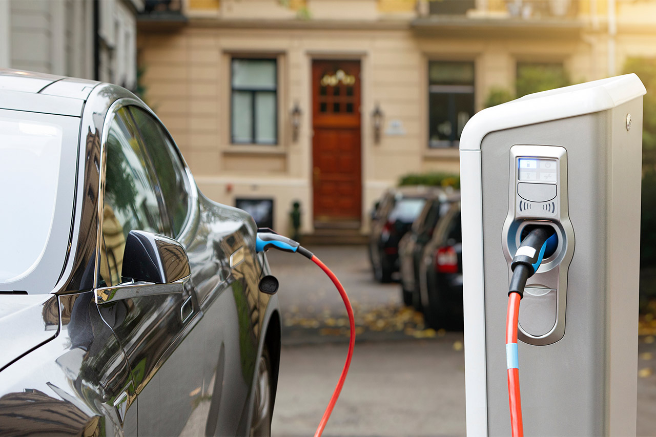 Car plugged into charging station