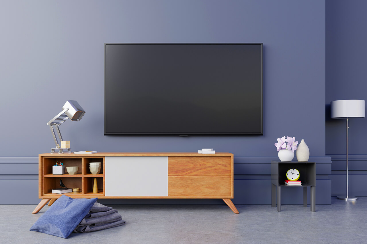 flast screen tv installed on living room wall