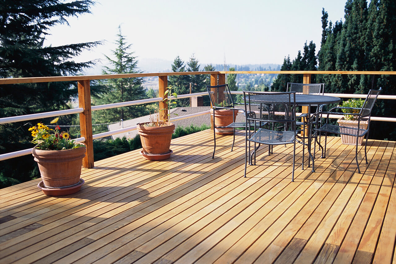 new deck on upper level of house overlooking trees