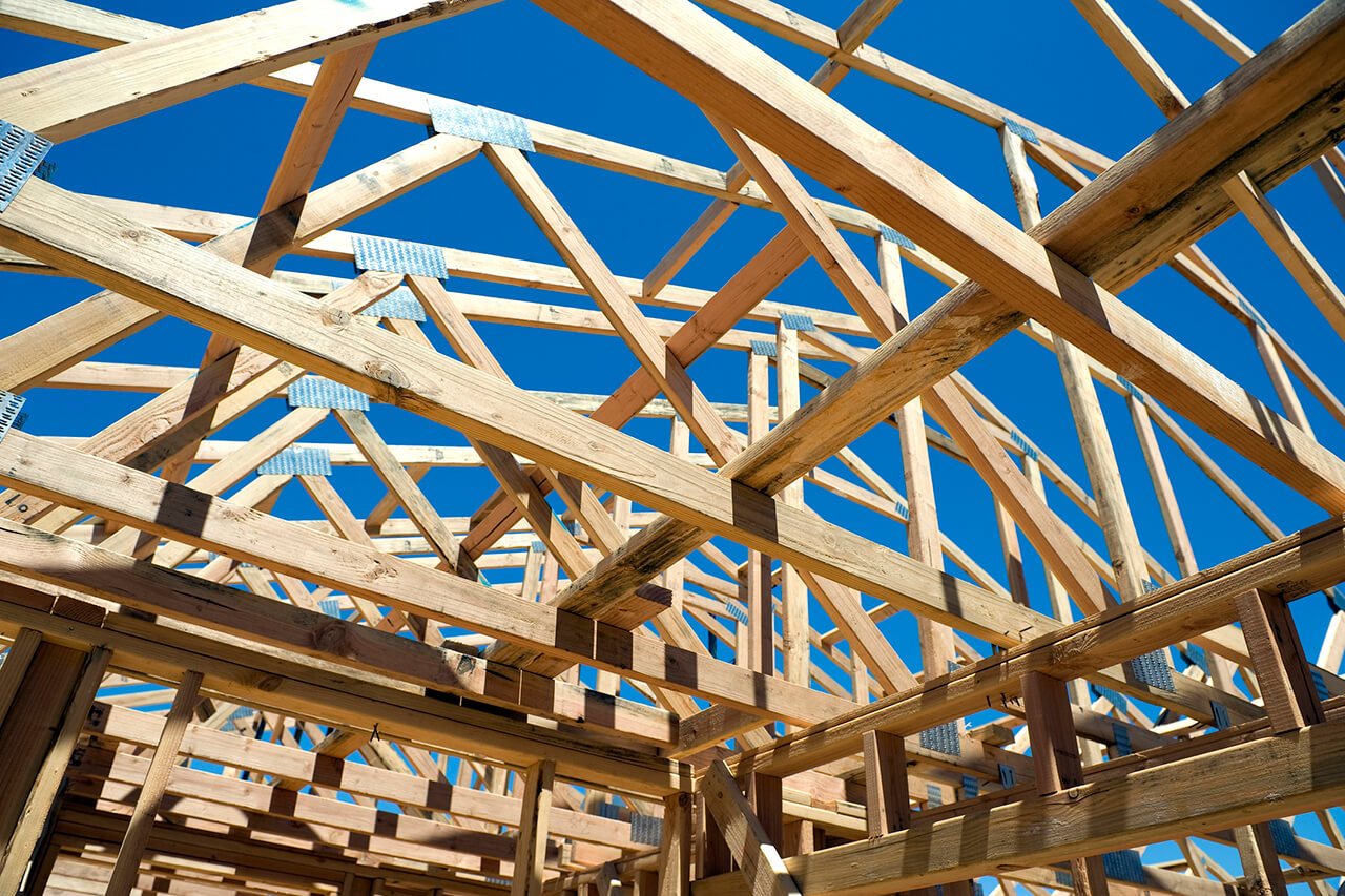 newly built roof framed with wooden trusses