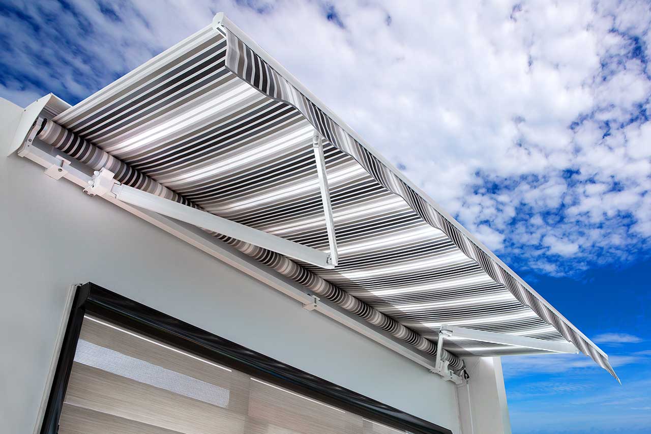 modern home with retractable canvas awning